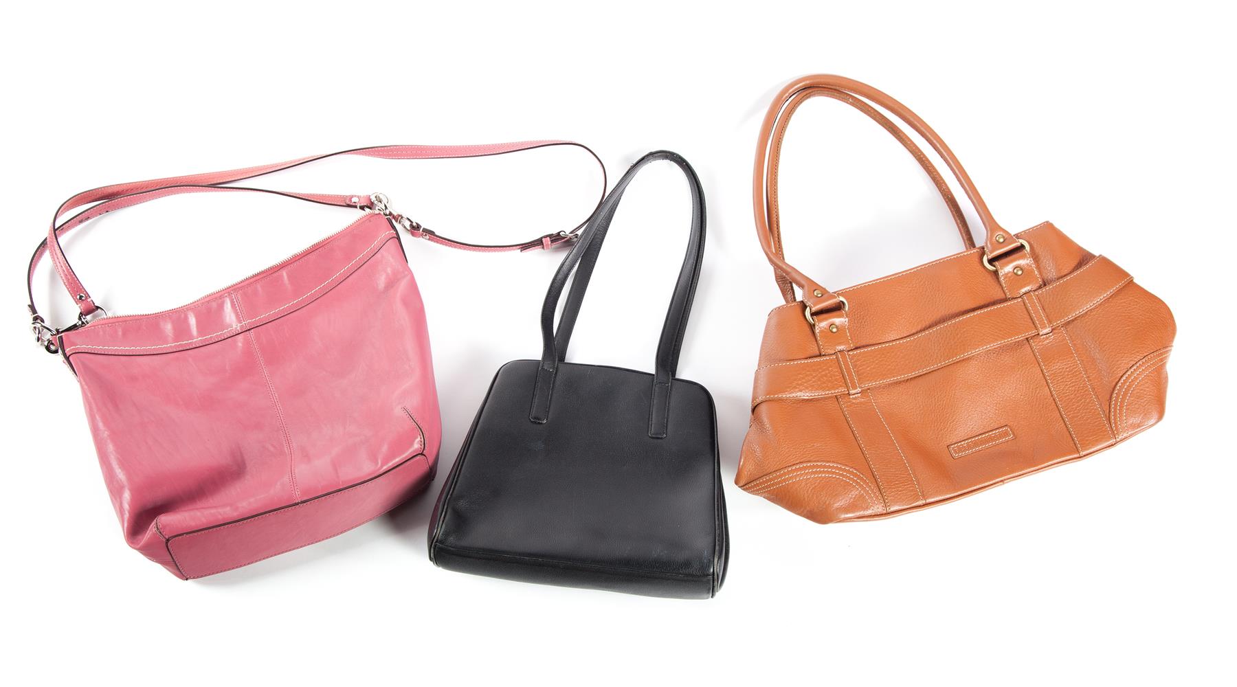 Appraisal: THREE HANDBAGS Twenty-first century Coach cross-body bag in pink Ferre