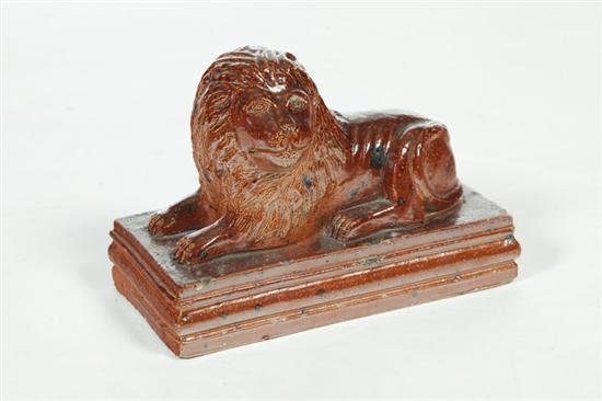 Appraisal: SEWERTILE LION Ohio early th century Reclining lion on a