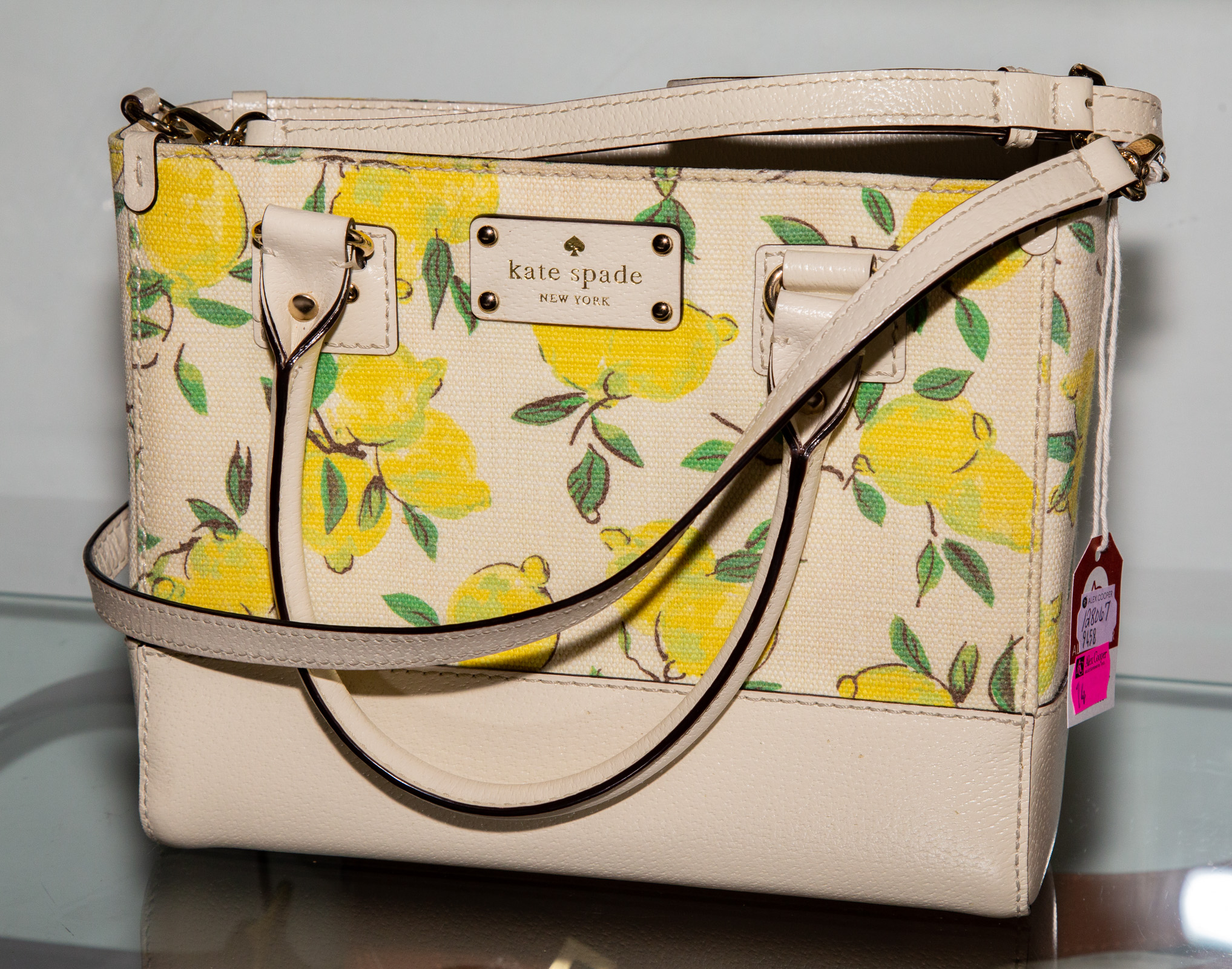 Appraisal: KATE SPADE LEMON PRINT CANVAS LEATHER PURSE with matching cream