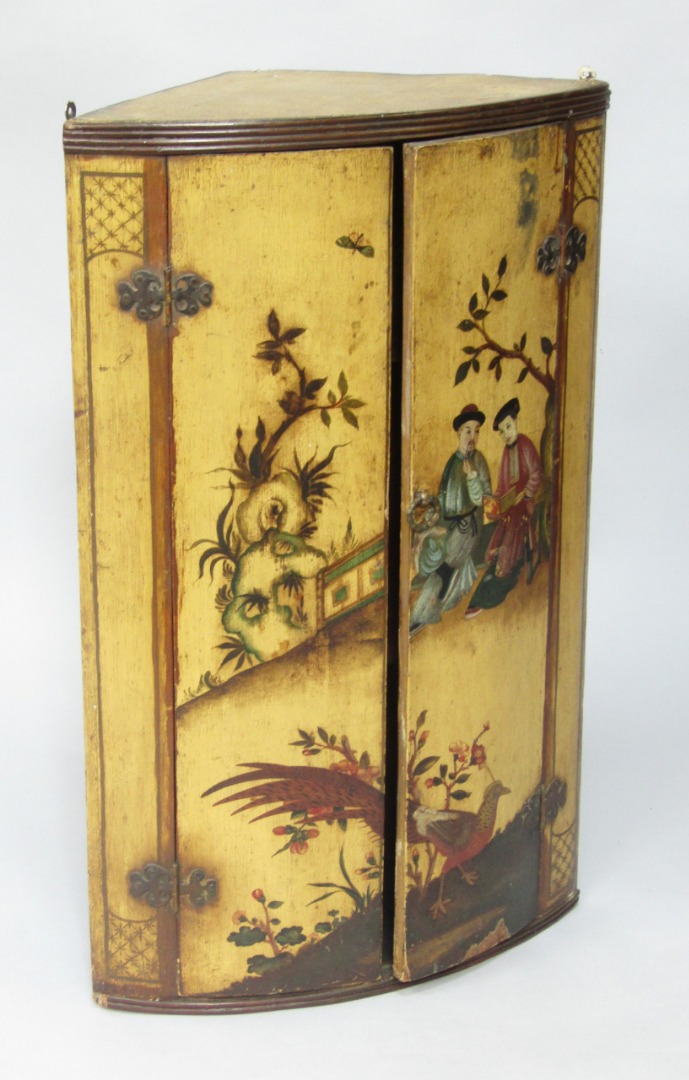 Appraisal: A Regency lacquered wall hanging corner cupboard the two doors