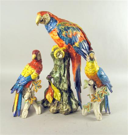 Appraisal: Three Continental porcelain parrots th century Modeled perched on branches