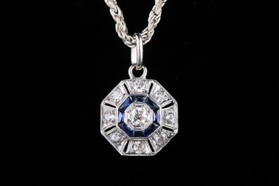 Appraisal: PLATINUM SAPPHIRE AND DIAMOND PENDANT WITH STERLING CHAIN Pierced octagonal