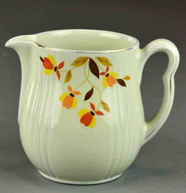 Appraisal: Hall Floral PitcherPottery pitcher with cream glaze having orange yellow