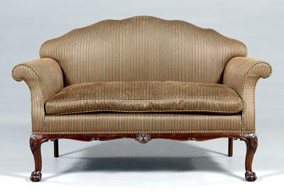 Appraisal: Chippendale style upholstered settee arched top and rolled arms down