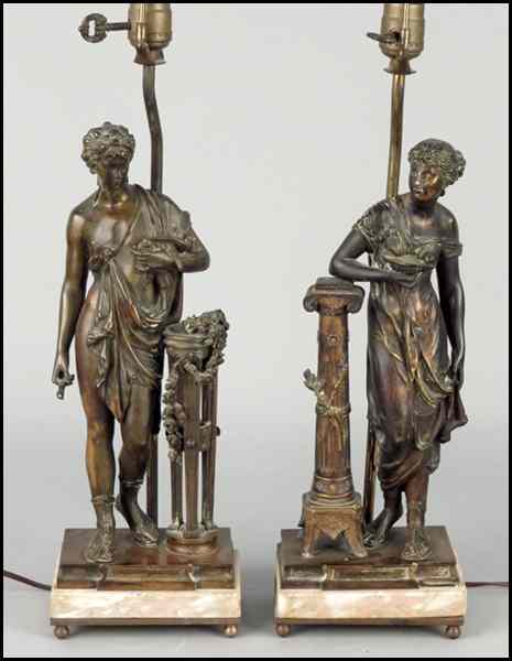 Appraisal: PAIR OF EMPIRE STYLE PATINATED METAL FIGURES Fitted as table