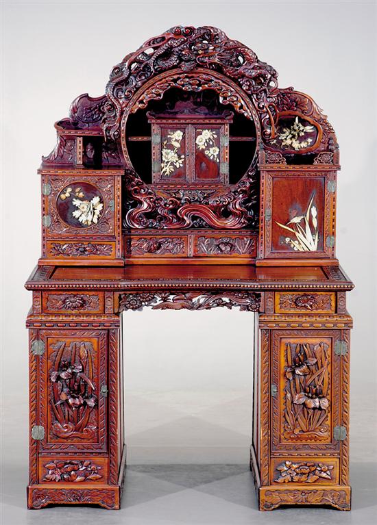 Appraisal: Oriental carved hardwood desk and chair circa superstructure of central