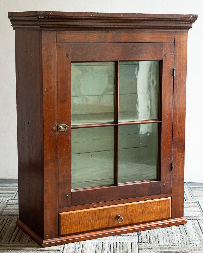 Appraisal: Cherry hanging cupboard early th c Cherry hanging cupboard early