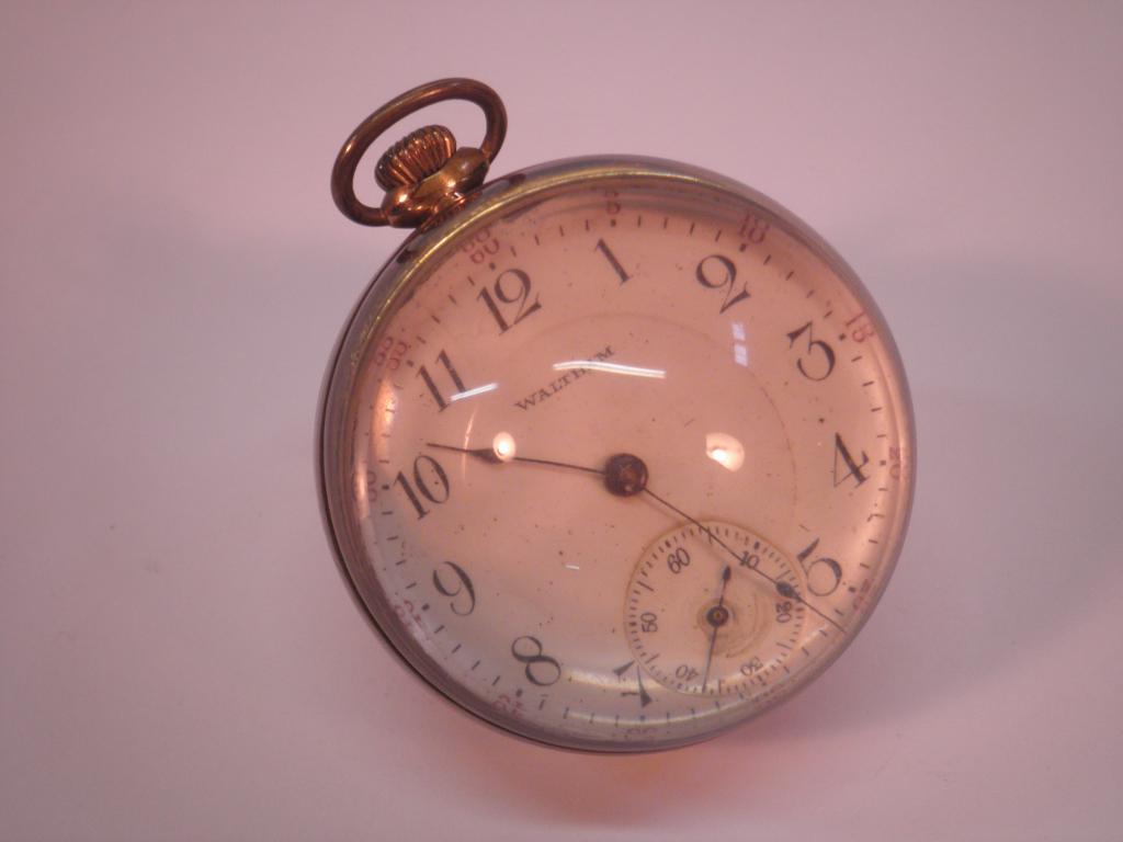 Appraisal: A Waltham gold plated pocket watch with enamel dial and