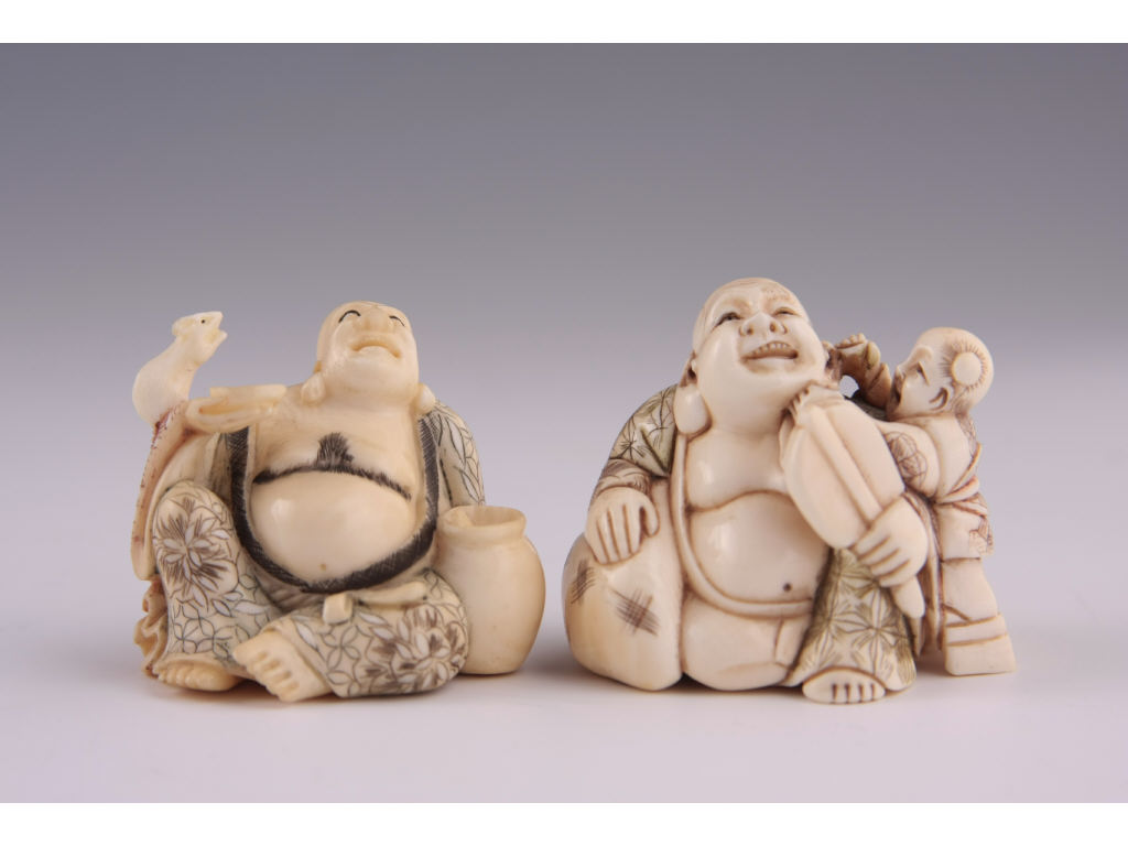 Appraisal: Two Netsukes Hotei Carved Ivory late period the first carving