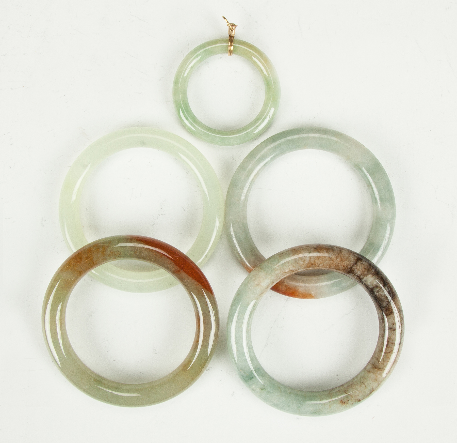 Appraisal: Four Chinese Jade Bracelets Pendant