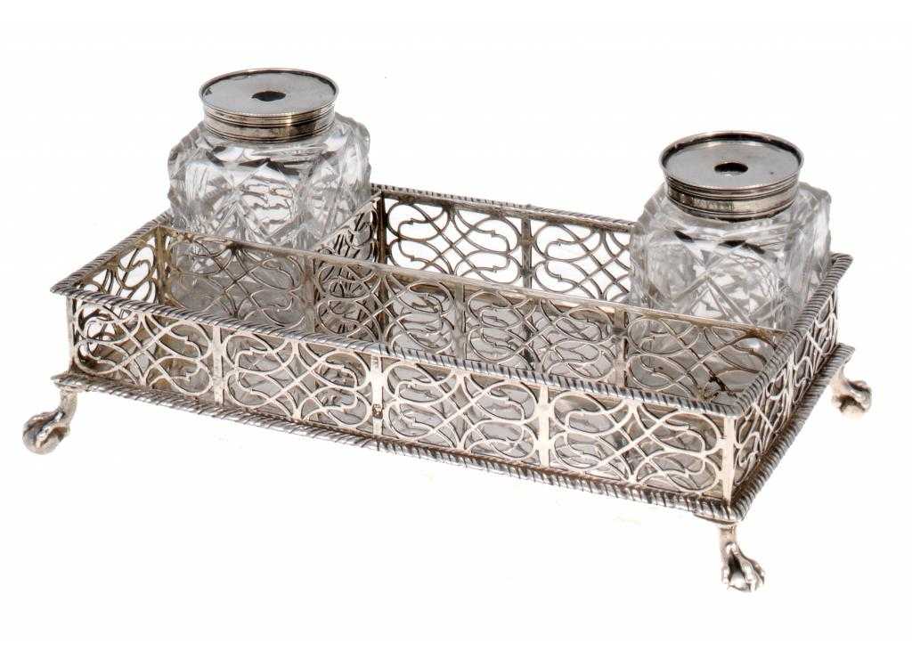 Appraisal: A GEORGE III INKSTAND the sides pierced in panels between