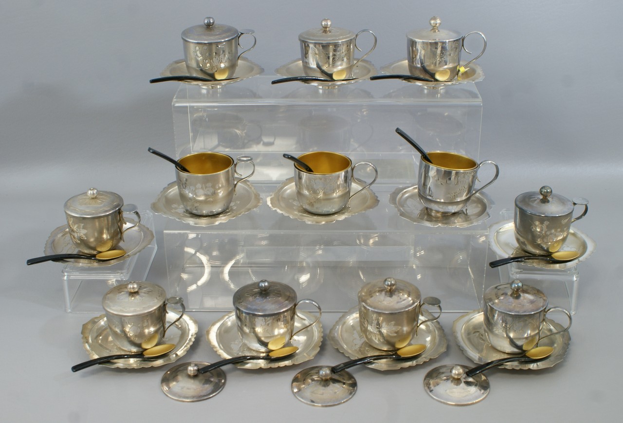 Appraisal: Cased set Japanese silver tea cups and saucers lacquered liners