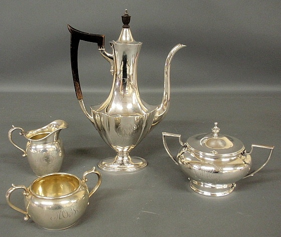 Appraisal: - Assembled four-piece sterling silver tea service- teapot with wood