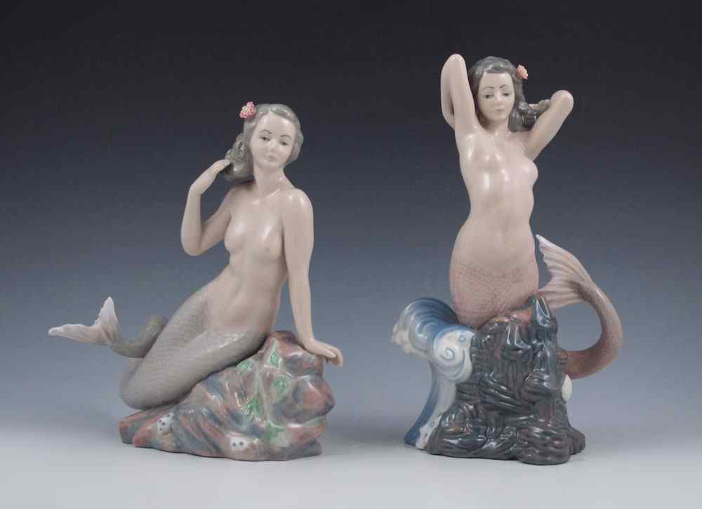 Appraisal: CASADES SPANISH PORCELAIN MERMAIDS Nude mermaid figures on rocky outcrops