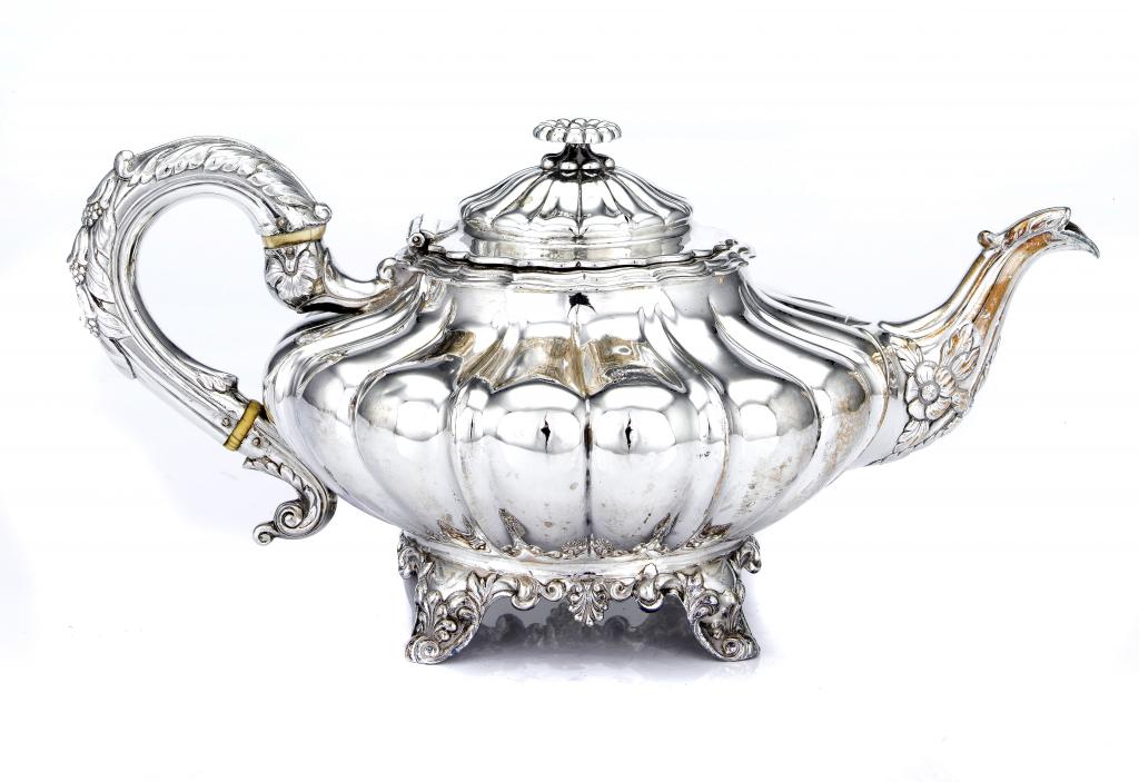 Appraisal: A VICTORIAN TEAPOT of melon form with flower knop the