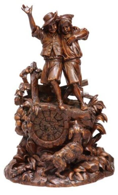 Appraisal: Black Forest figural mantel shelf clock late th c carved