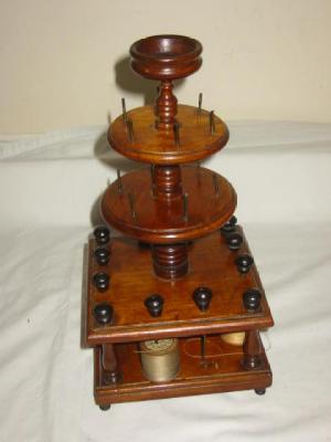 Appraisal: A VICTORIAN BOBBIN STAND of Birdcage form having two circular