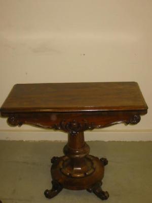 Appraisal: A VICTORIAN ROSEWOOD FOLDING TEA TABLE of rounded oblong form