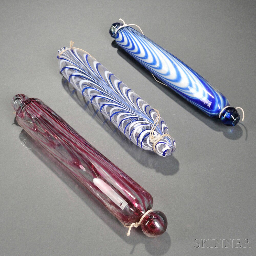 Appraisal: Three Nailsea Glass Rolling Pins England th century in ruby