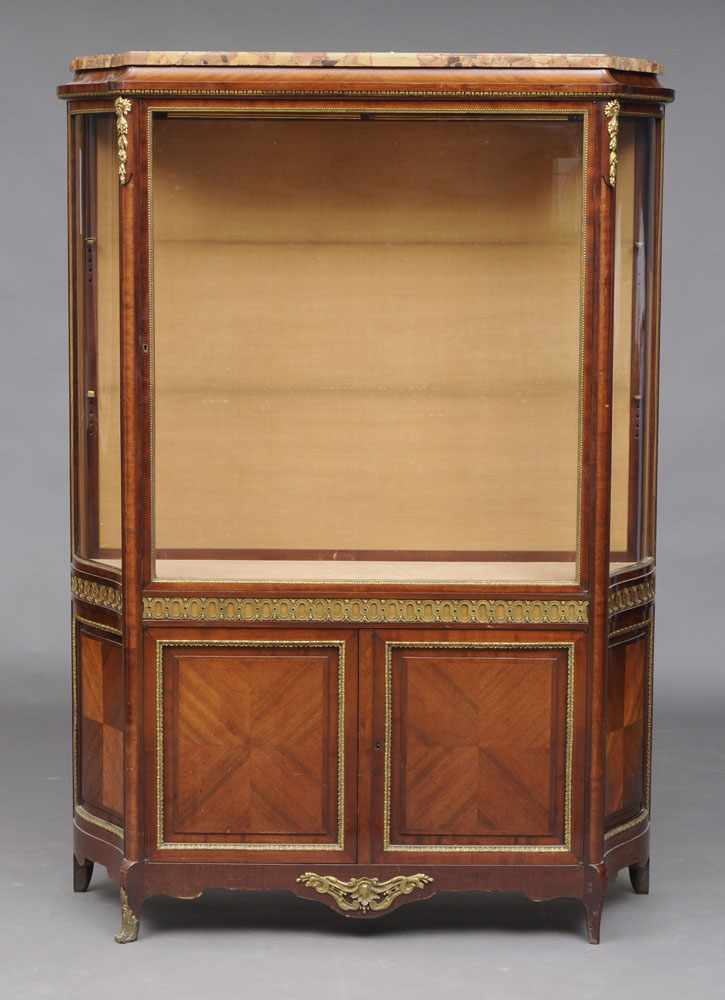 Appraisal: LOUIS XVI STYLE GILT-METAL MOUNTED MAHOGANY VITRINE CABINET The shaped