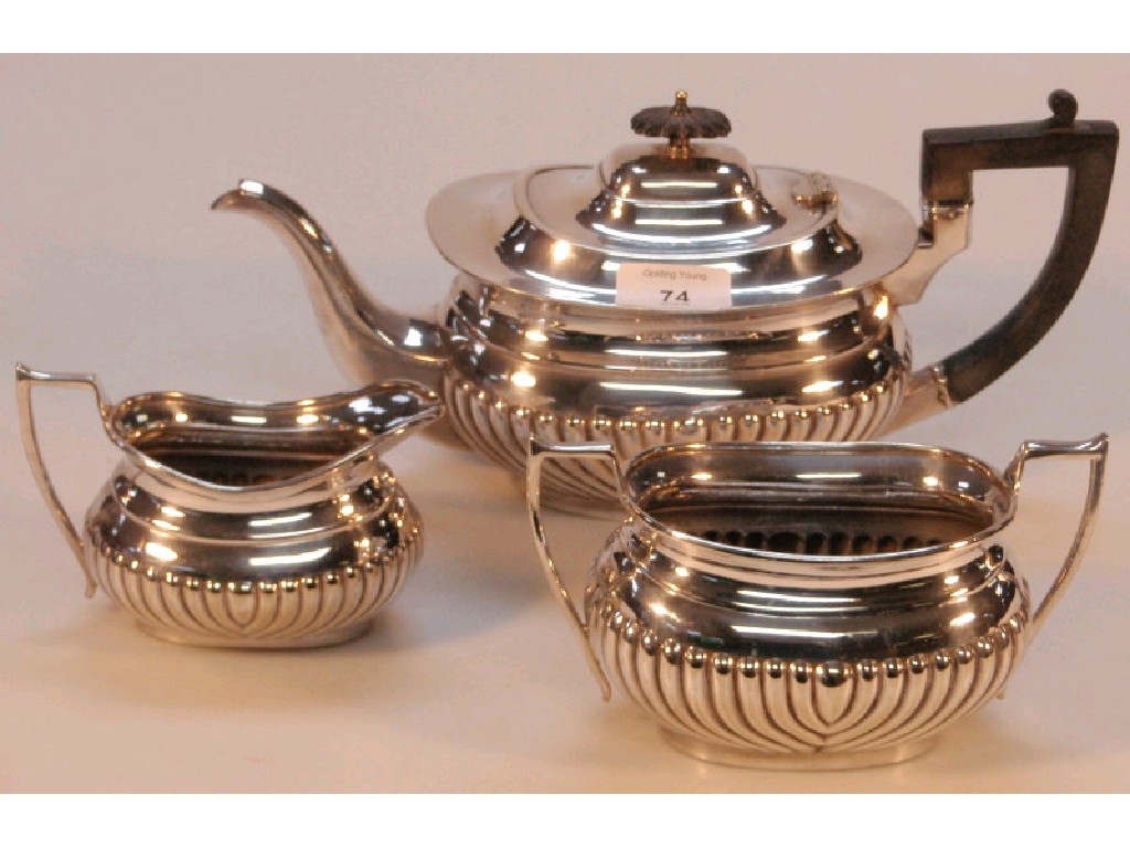 Appraisal: An electroplate three piece tea set of part reeded London