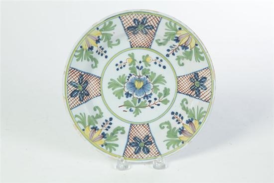 Appraisal: DELFT PLATE England th century Polychrome floral design on white