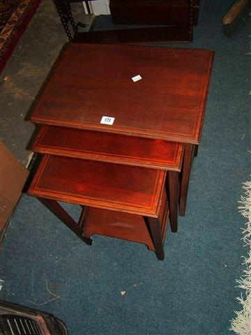 Appraisal: An Edwardian mahogany and satinwood inlaid nest of three tables