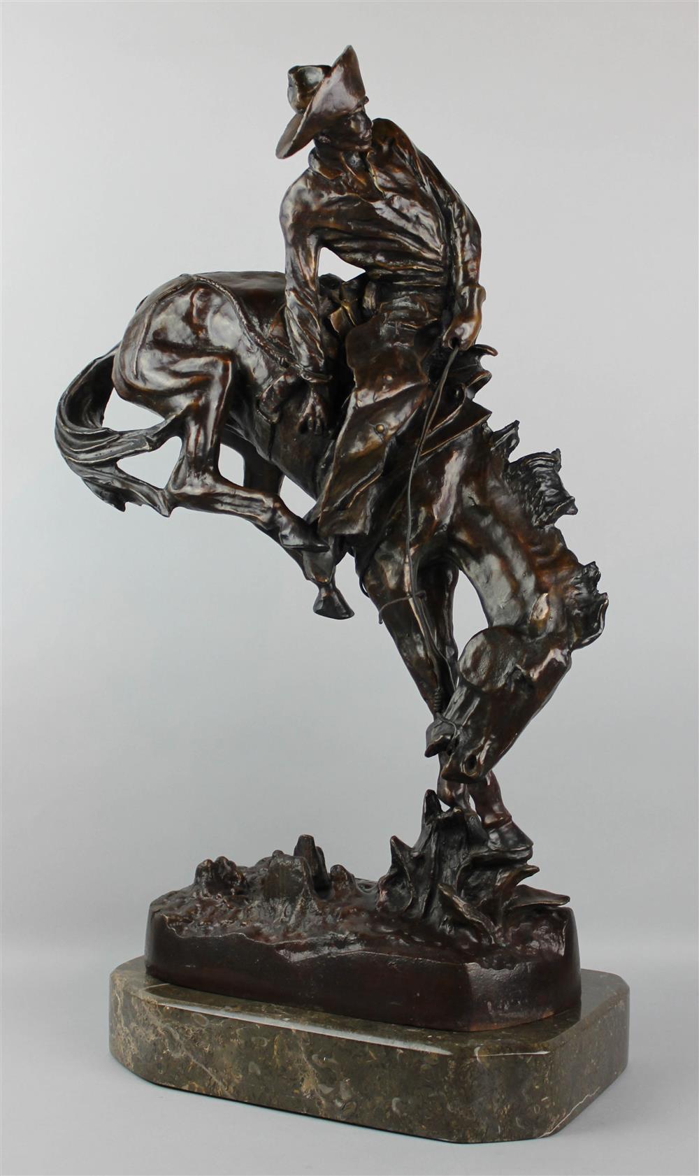 Appraisal: BRONZE OF THE OUTLAW AFTER REMINGTON mounted on a marble