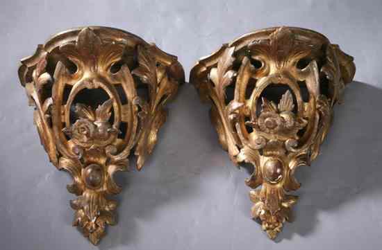 Appraisal: PAIR LOUIS XV STYLE GILT-COMPOSITION WALL BRACKETS Carved foliate swag