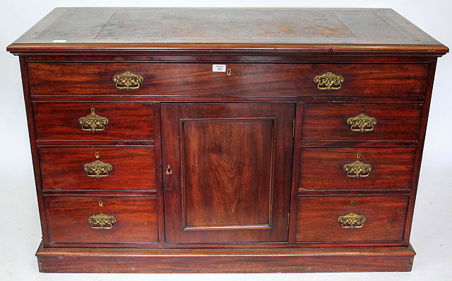 Appraisal: A LATE VICTORIAN MAHOGANY DESK with a brown leather inset