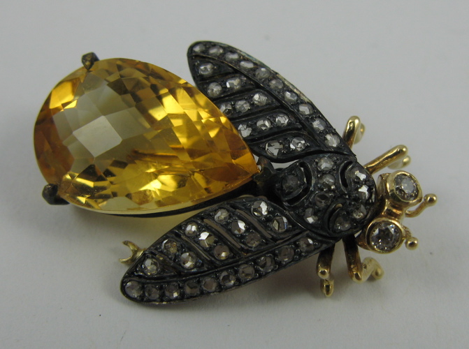 Appraisal: CITRINE DIAMOND SILVER AND K GOLD BROOCH set with a