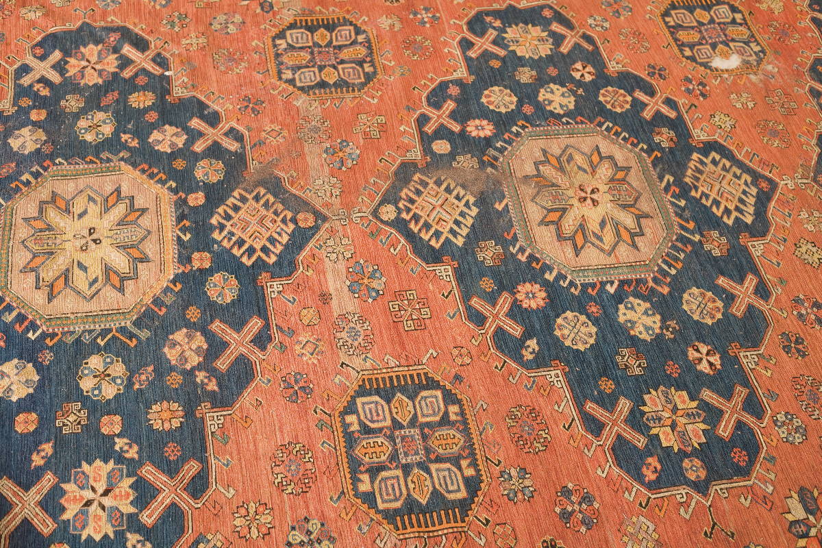 Appraisal: EAST CAUCASIAN SOUMAC CARPET EARLY TWENTIETH CENTURY The madder red