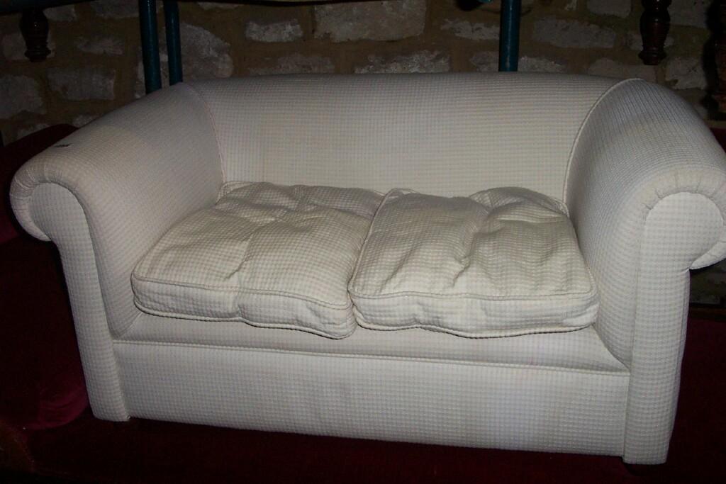 Appraisal: A Victorian style child's -seat Chesterfield sofa with cream upholstered