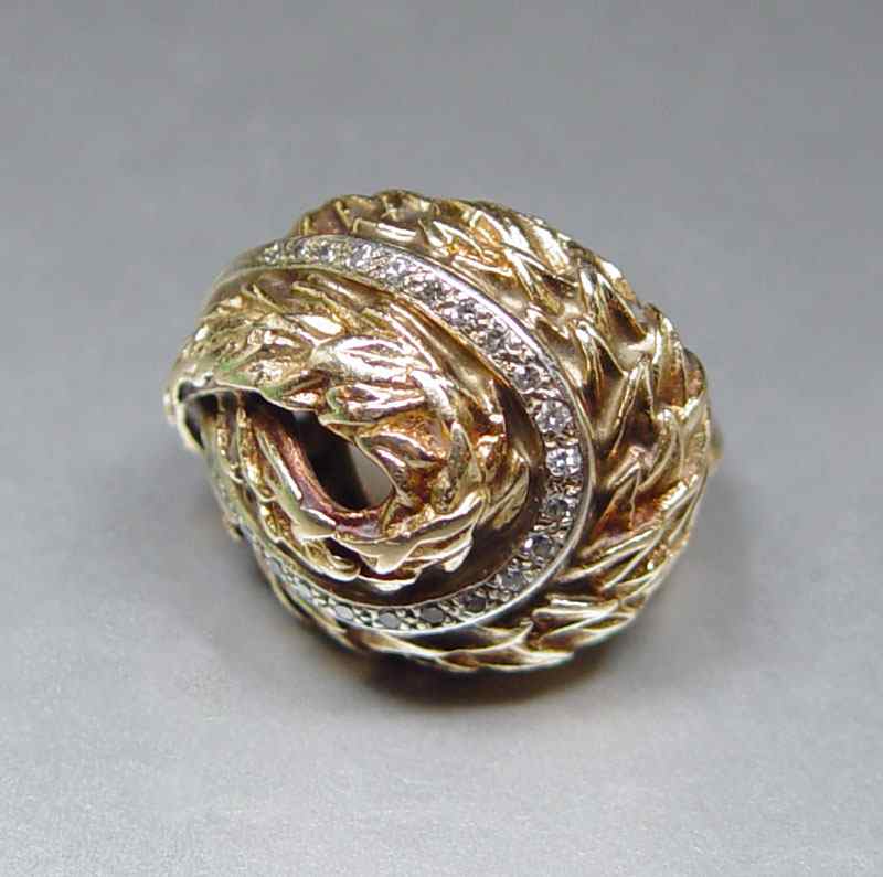 Appraisal: GOLD AND DIAMOND FASHION RING K yellow gold ring contains