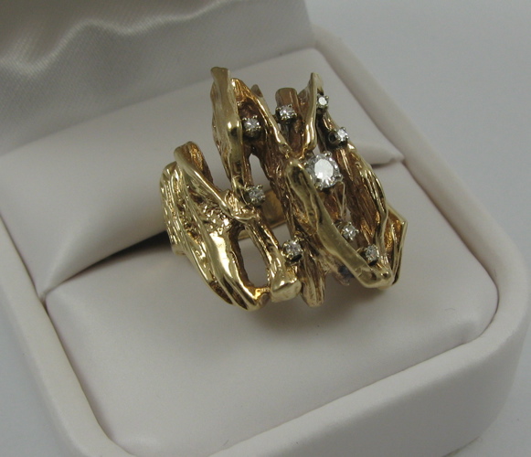 Appraisal: DIAMOND AND K YELLOW GOLD RING set with nine round-cut