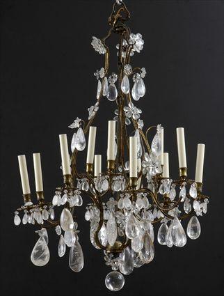 Appraisal: LOUIS XV-STYLE ROCK-CRYSTAL HUNG GILT-BRONZE TWELVE-LIGHT CHANDELIER The pear-form skeletal