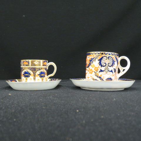 Appraisal: Royal Crown Derby China Cups Saucers Imari style colors elaborate