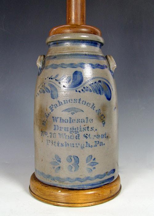 Appraisal: COBALT DECORATED STONEWARE PITTSBURG DRUGGIST ADVERTISING CROCK Mounted as a