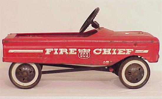 Appraisal: An AMF tin pedal car in red paint with white