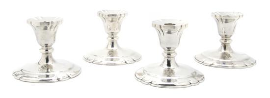 Appraisal: A Set of Four American Sterling Silver Hand Hammered Candlesticks