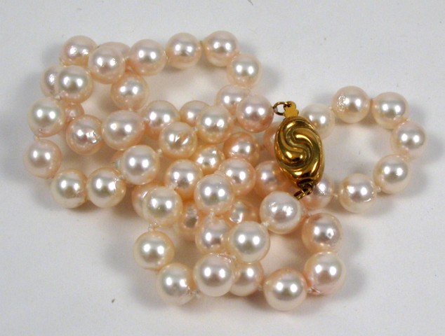 Appraisal: PEARL AND EIGHTEEN KARAT GOLD NECKLACE - in length and