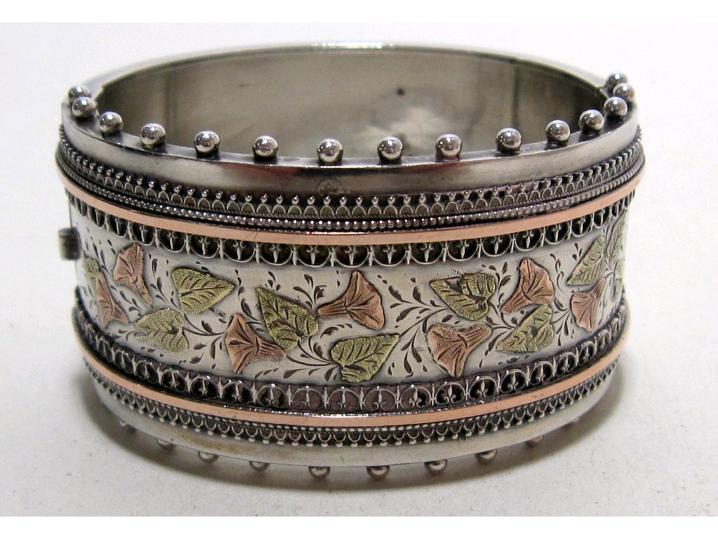 Appraisal: Victorian silver bangle with gold onlay leaf decoration