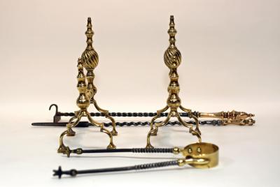 Appraisal: A pair of brass andirons and a set of steel