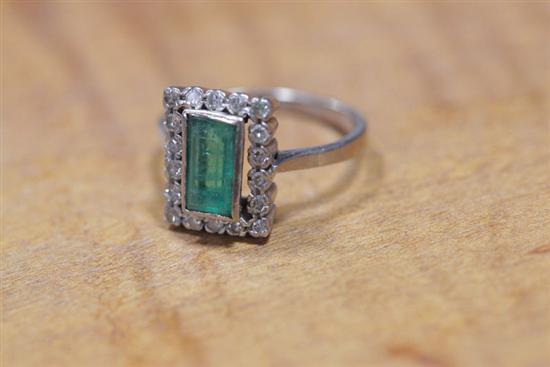 Appraisal: LADIES WHITE GOLD RING Bezel set rectangular central emerald surrounded