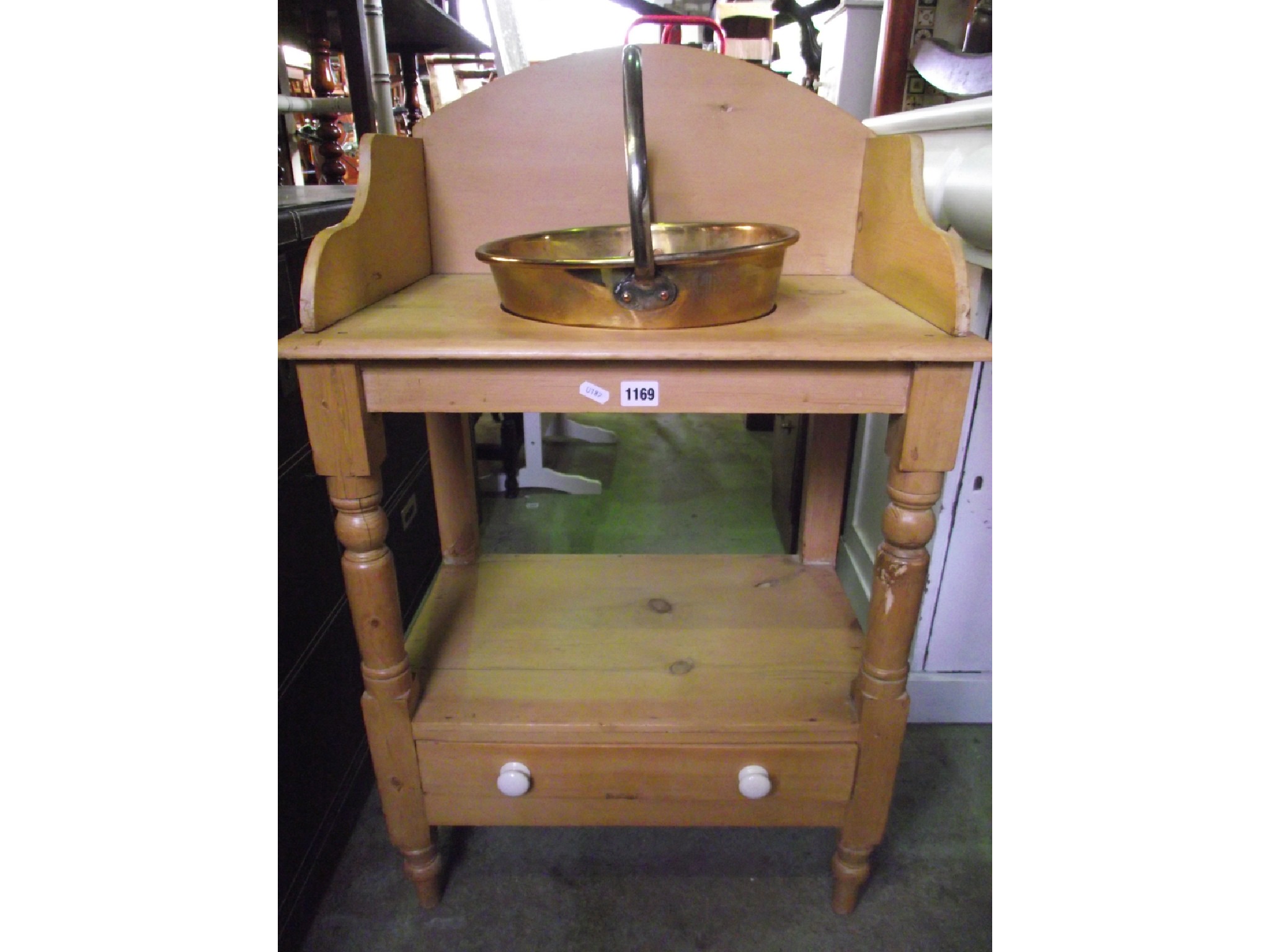 Appraisal: A small Victorian stripped pine two tier washstand with open