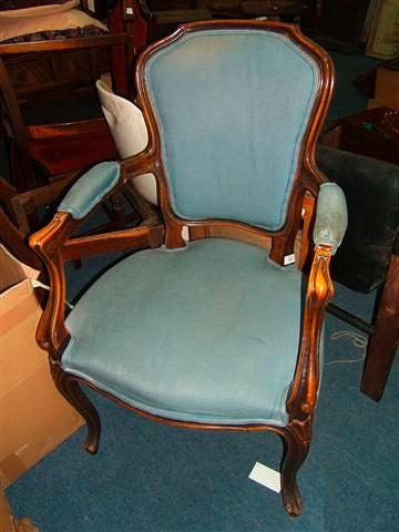 Appraisal: A French open armchair with cabriole legs and blue upholstered