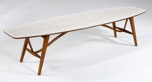 Appraisal: DREXEL Walnut surfboard coffee table with patterned white laminate top