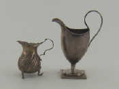 Appraisal: A late Victorian embossed silver cream jug on three feet