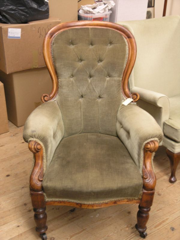 Appraisal: A Victorian mahogany spoon-back armchair with carved detail on front