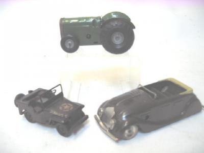 Appraisal: Three Minic clockwork tinplate toys comprising green farm tractor with